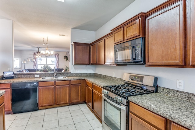 kitchen featuring light tile patterned flooring, sink, an inviting chandelier, and black appliances