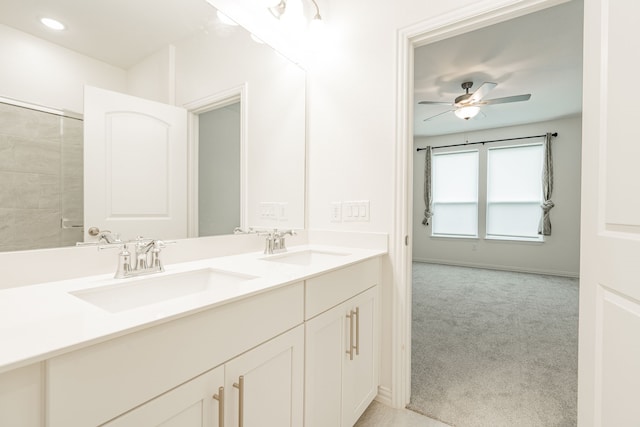 bathroom featuring ceiling fan and vanity