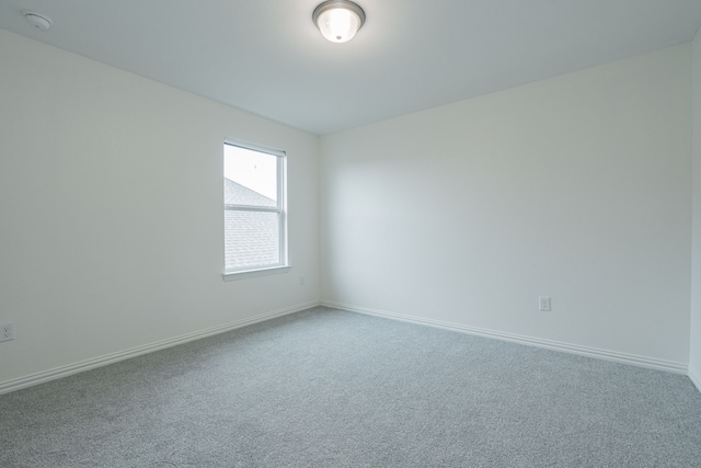 unfurnished room with carpet floors