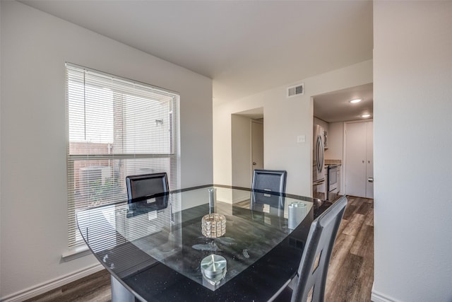 dining space featuring dark hardwood / wood-style floors