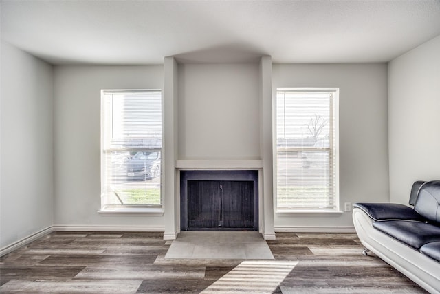 living room featuring dark hardwood / wood-style flooring and plenty of natural light