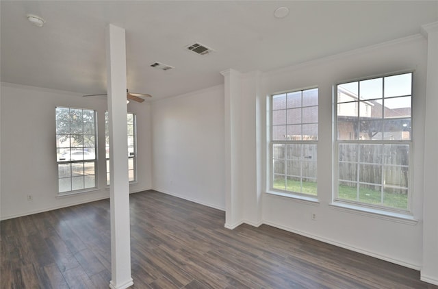 spare room featuring dark hardwood / wood-style flooring, ceiling fan, and ornamental molding