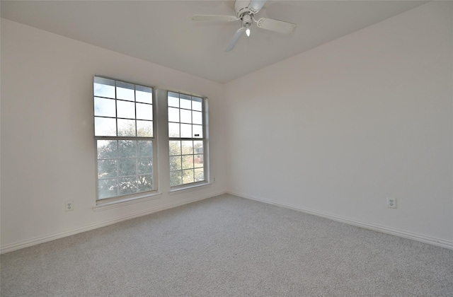 spare room with ceiling fan and carpet floors