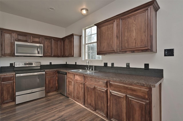 kitchen with sink, dark brown cabinets, and appliances with stainless steel finishes