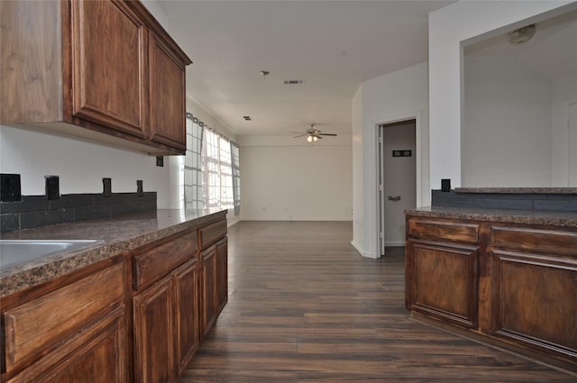 kitchen featuring dark hardwood / wood-style floors and ceiling fan