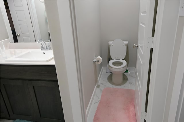 bathroom with vanity and toilet