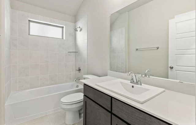 full bathroom with tile patterned floors, vanity, toilet, and tiled shower / bath combo