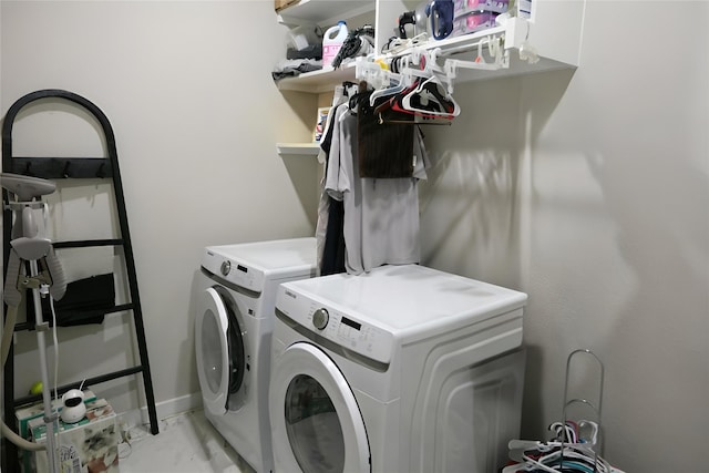 laundry room featuring washing machine and dryer