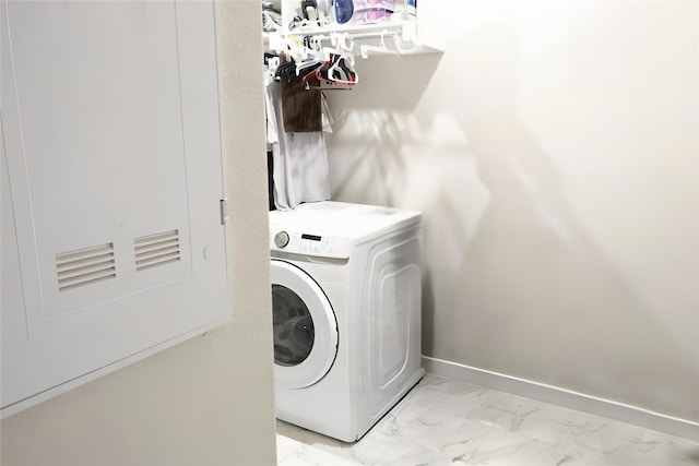 clothes washing area with washer / clothes dryer