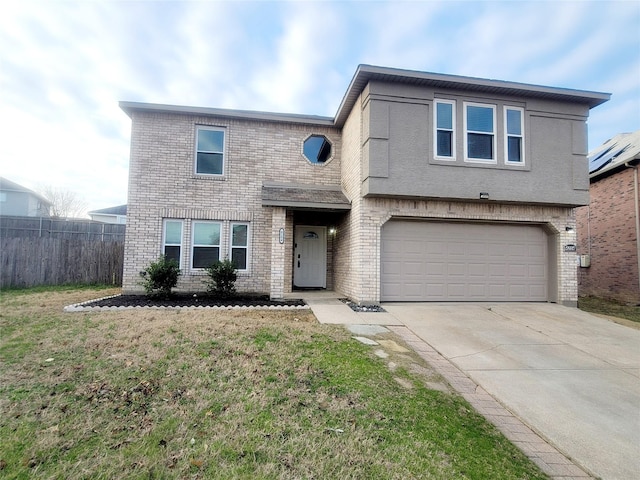 traditional-style home with driveway, brick siding, and fence