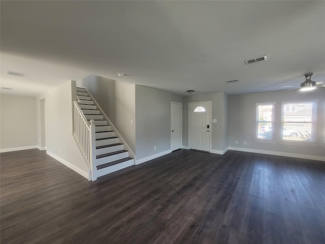 entrance foyer featuring dark hardwood / wood-style flooring and ceiling fan