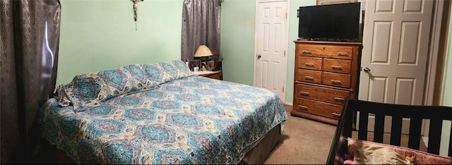 bedroom with carpet and lofted ceiling