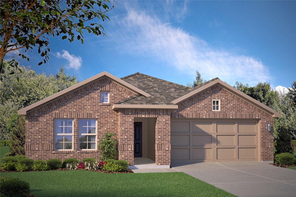 view of front of house with a garage and a front yard