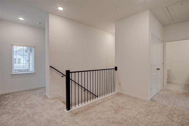 stairs featuring carpet floors