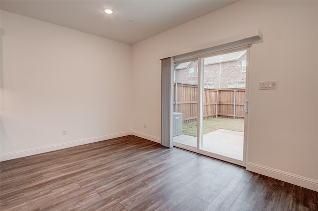 unfurnished room featuring hardwood / wood-style flooring