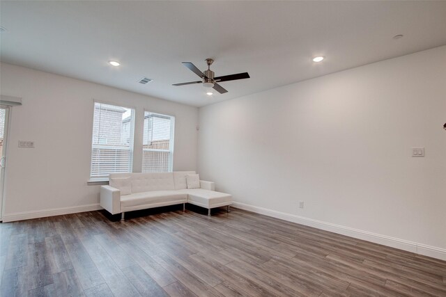 unfurnished room with hardwood / wood-style flooring and ceiling fan