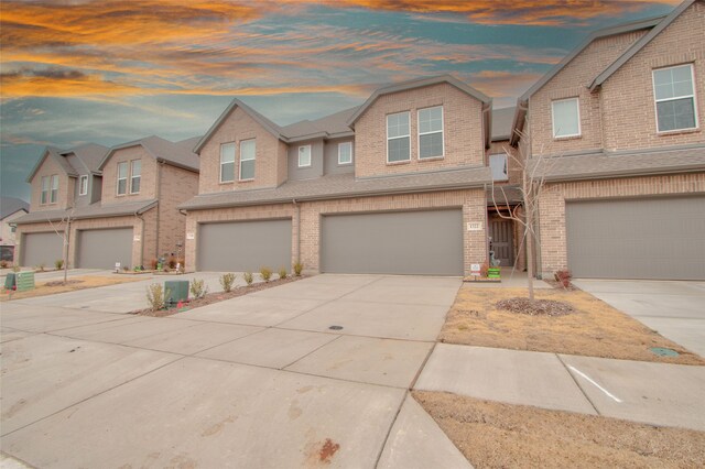 multi unit property featuring a garage