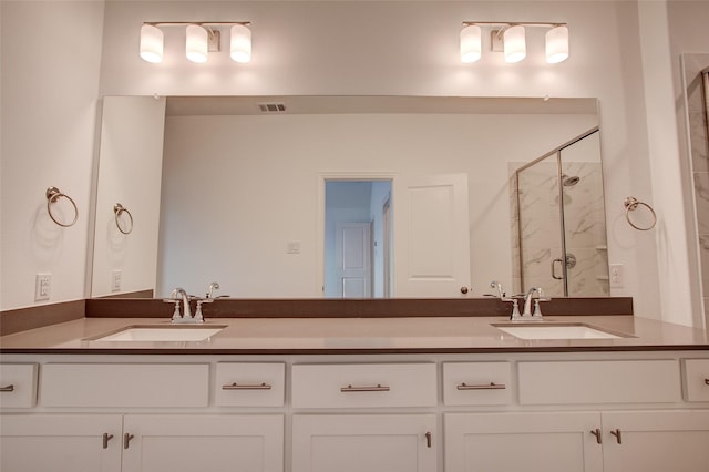 bathroom with vanity and an enclosed shower