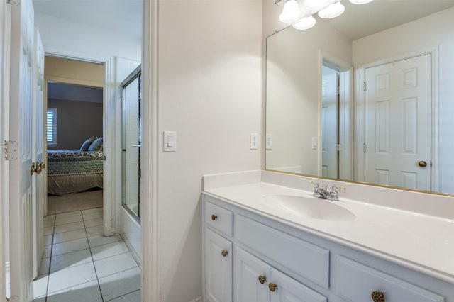 bathroom with tile patterned flooring and vanity