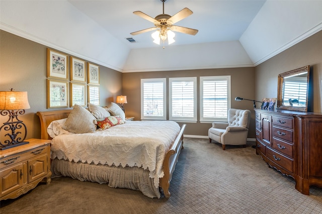 carpeted bedroom with ceiling fan, lofted ceiling, and ornamental molding