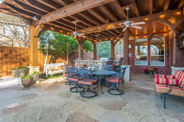 view of patio with ceiling fan and an outdoor living space