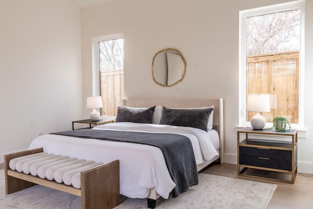 bedroom with light hardwood / wood-style flooring