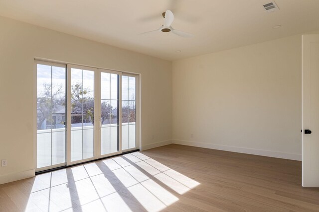 unfurnished room featuring ceiling fan and light hardwood / wood-style flooring