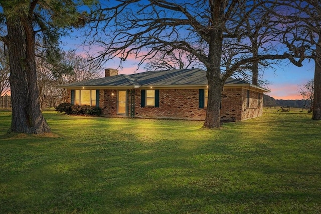 view of front of home with a lawn