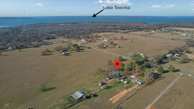 aerial view with a water view and a rural view