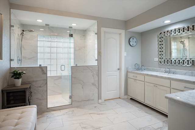 bathroom featuring vanity and a shower with shower door