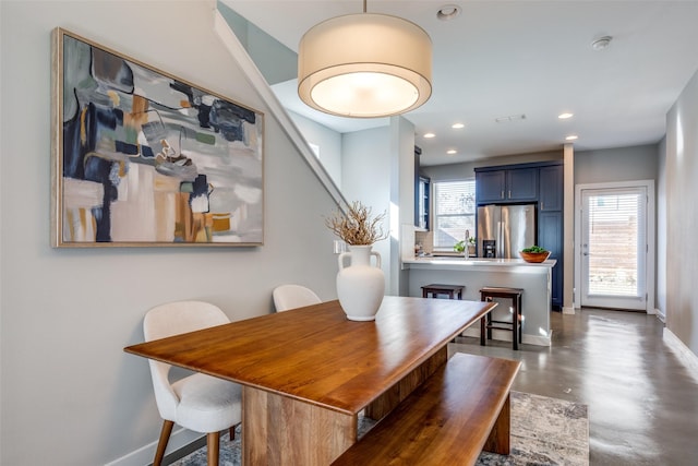 dining space featuring a healthy amount of sunlight