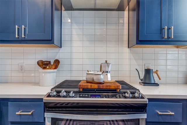 kitchen featuring stainless steel gas range oven and blue cabinetry