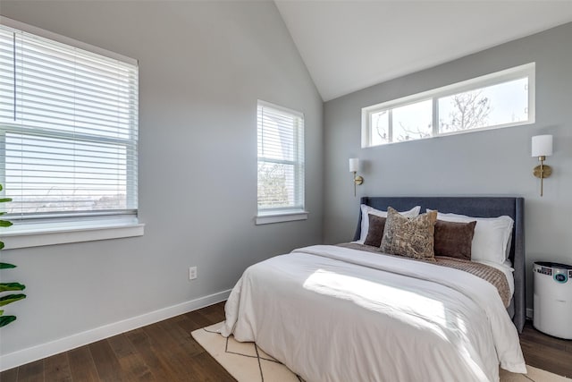 bedroom with dark hardwood / wood-style floors and vaulted ceiling