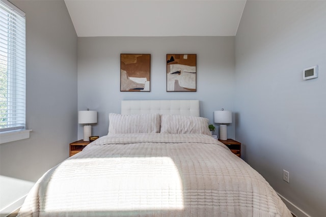 bedroom featuring vaulted ceiling