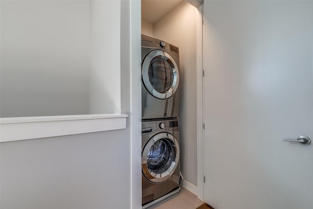 laundry area featuring stacked washing maching and dryer