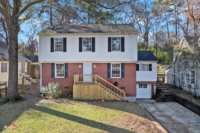 view of front of home with a garage and a front yard