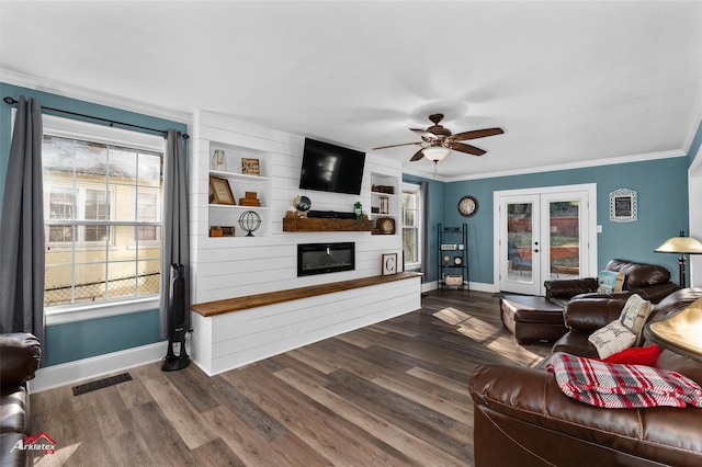 living room with wood-type flooring, french doors, built in features, and ceiling fan