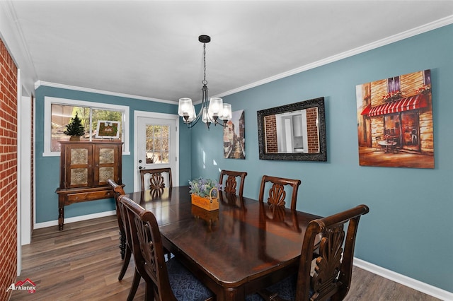 dining space featuring a chandelier, dark hardwood / wood-style flooring, and ornamental molding