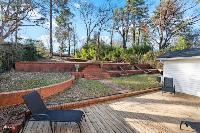 wooden terrace featuring a yard