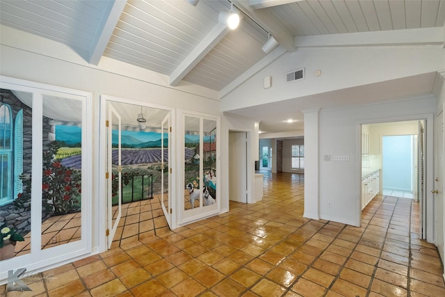 unfurnished sunroom with vaulted ceiling with beams and wood ceiling