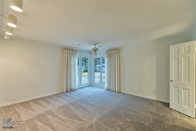 unfurnished room with carpet floors, ceiling fan, and ornamental molding