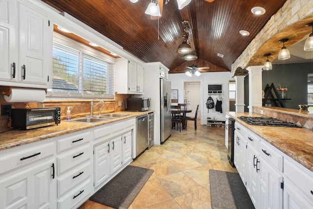 kitchen with white cabinetry, sink, pendant lighting, and appliances with stainless steel finishes