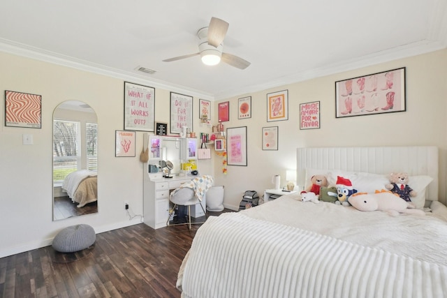 bedroom featuring crown molding, dark hardwood / wood-style floors, and ceiling fan