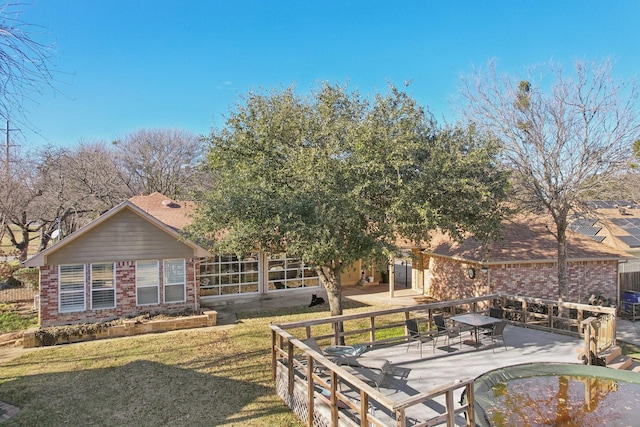 exterior space featuring a yard and a patio area