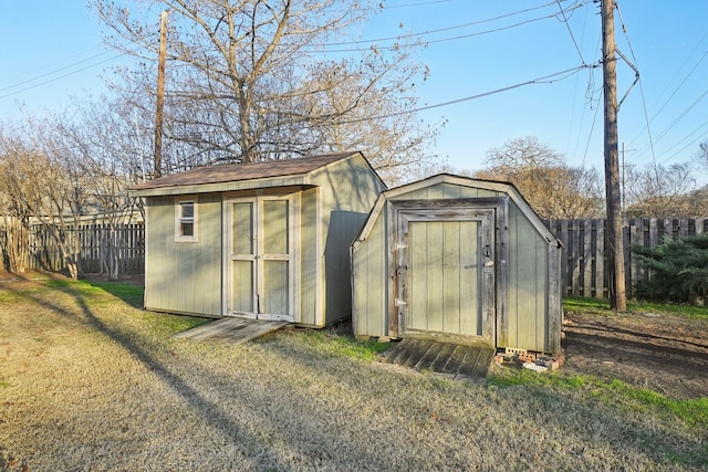 view of outbuilding featuring a lawn