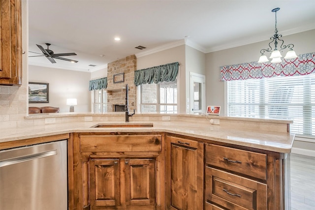 kitchen with backsplash, ceiling fan, sink, light hardwood / wood-style flooring, and dishwasher