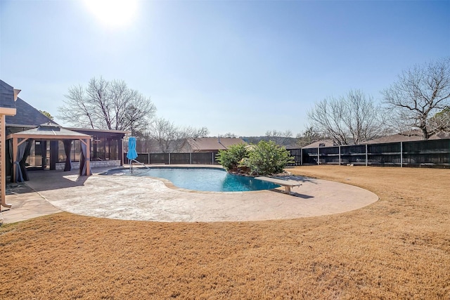 view of swimming pool featuring a patio, a yard, a gazebo, and a diving board