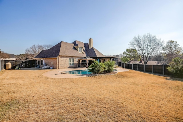 view of yard with a fenced in pool and a patio area