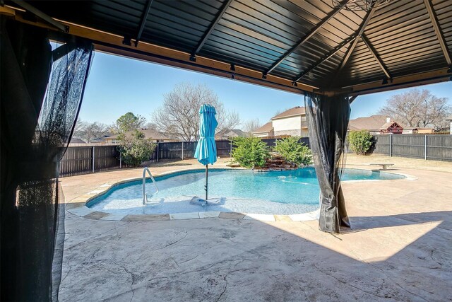 view of pool featuring a patio and a gazebo