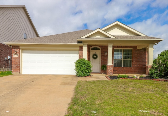 view of front of house with a front yard and a garage